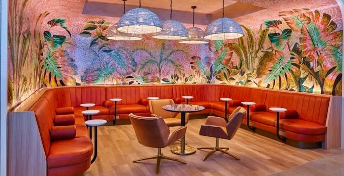 The Coffee Grotto, featuring banquette seating and vibrant artwork