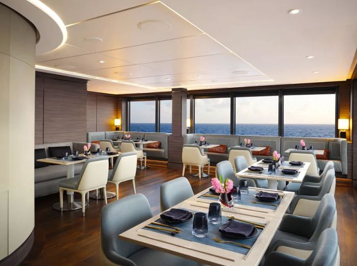 Interior of the gray and white Asian restaurant Talaat Nam aboard the Ritz-Carlton Yacht Collection's 