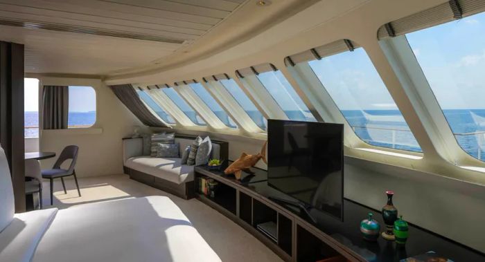 Interior view of the Explorer Suite, located at the front of the boat and boasting panoramic windows.