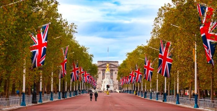 LONDON, UK - OCTOBER 28, 2012: A view along The Mall, the iconic ceremonial approach to Buckingham Palace adorned with Union Jack flags