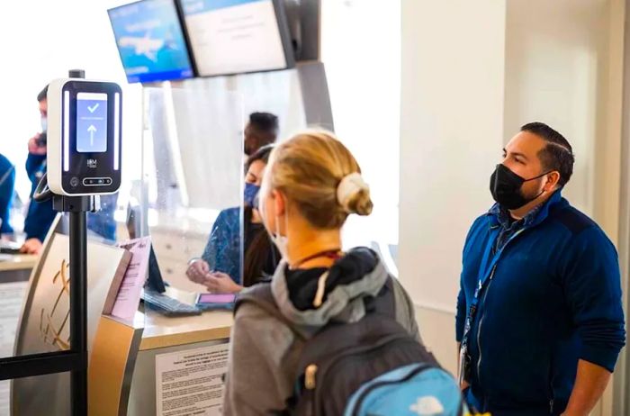 A passenger from Alaska Airlines utilizes facial recognition to board their flight