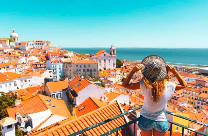 Traveler gazing over Lisbon, Portugal