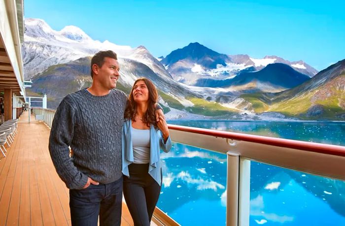 Couple aboard Dinogo Bliss admiring the Alaskan waterfront