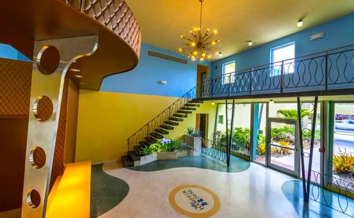 The entrance of Hampton House, featuring blue splashes on the floor and an elegant pinlight chandelier