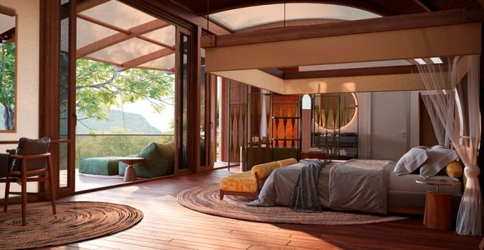 Few & Far Luvhongo Lodge is set to open in South Africa's UNESCO-listed Vhembe Biosphere Reserve by the end of 2024. This guest room boasts wooden flooring, high ceilings, a spacious bed, and a generous veranda.