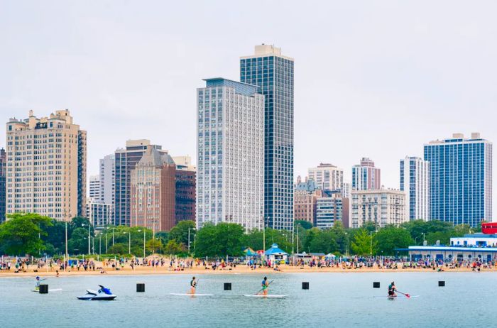 Visitors enjoying the water at North Avenue Beach in Chicago, Illinois