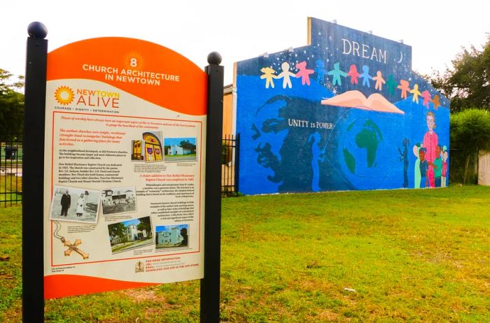 An orange sign provides detailed information about Newtown