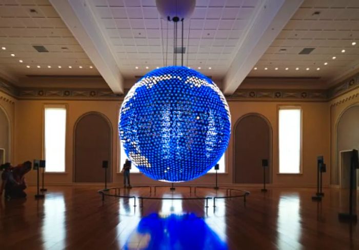 A dazzling globe suspended within Planet Word, a voice-activated museum located in Washington, D.C.