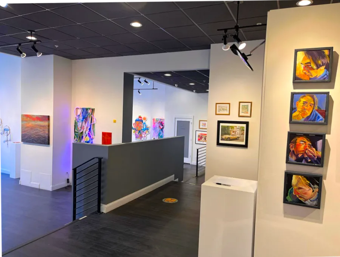 Artwork displayed on white walls within an exhibition space