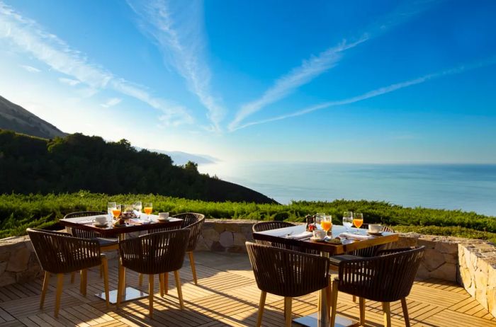 At the Sur House restaurant in Ventana Big Sur, enjoy two intimate four-seat dining tables on an outdoor deck that offers stunning views of the Pacific Ocean.