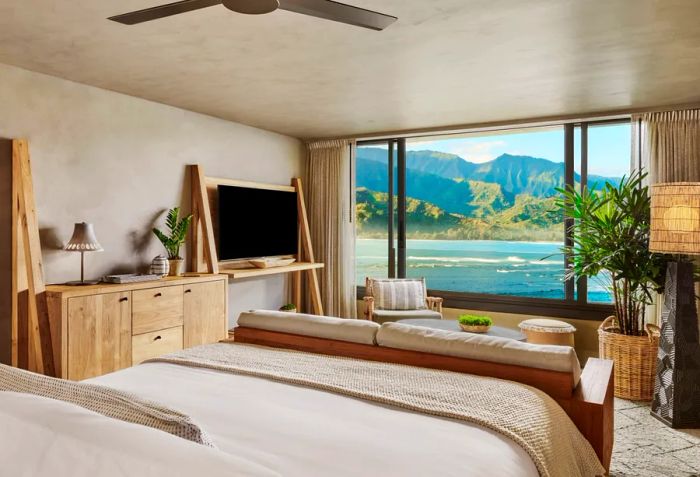 A room showcasing breathtaking views of both the ocean and mountains at 1 Hotel Hanalei Bay.