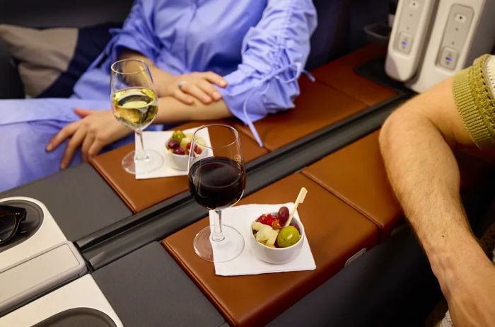 Some aisle seats in the Business Class Classic Suites are perfect for couples, as the dividing wall can be retracted to form a double suite.