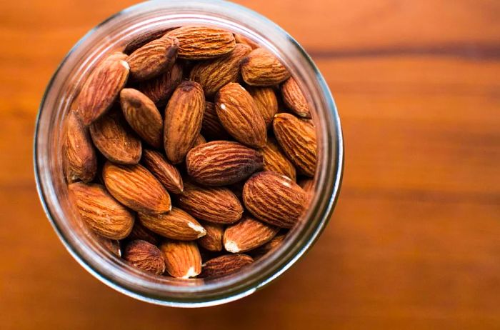 Consuming dry-roasted almonds coated with tamari (a gluten-free soy sauce) can help reduce cholesterol levels.