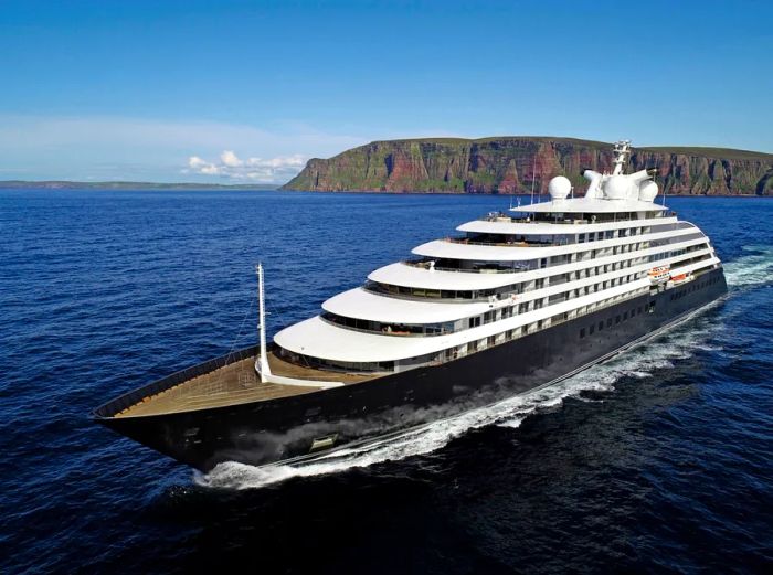 the Scenic Eclipse yacht-style expedition vessel gliding through azure waters