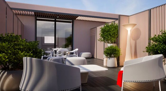 The exclusive outdoor patio space for Air France's new guest suites, featuring outdoor furniture like chairs and tables surrounded by lush plants.