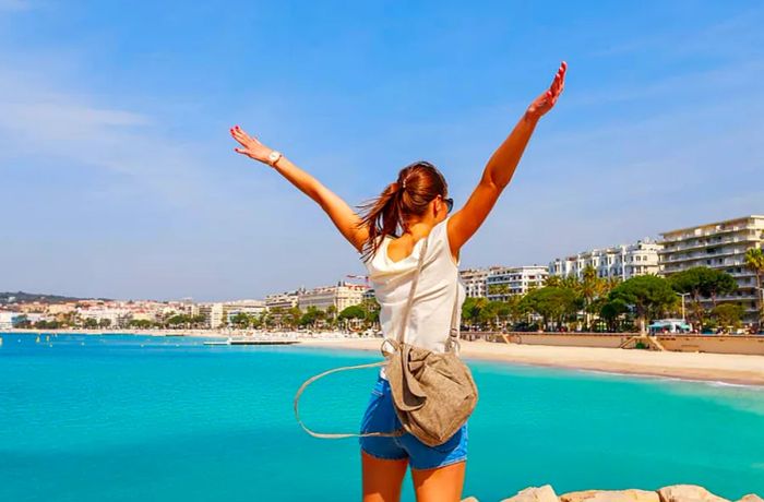 Tourist woman enjoying the sights in Cannes, Cote d'Azur, France