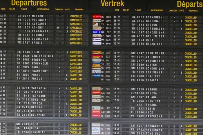 The departures display at Brussels International Airport during a strike