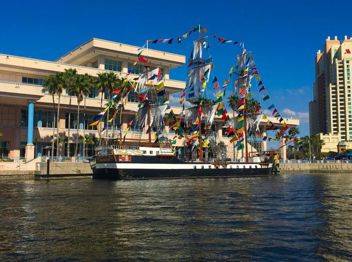 An image of the Gasparilla Pirate Ship adorned with vibrant flags in Tampa, Florida