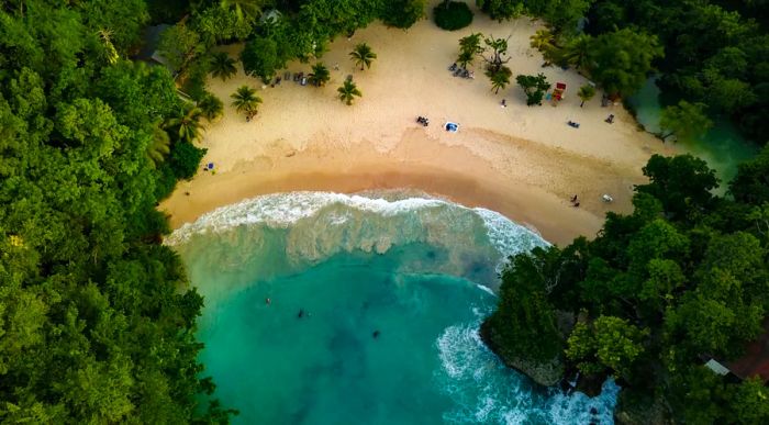 Aerial view of Frenchman's Cove in Jamaica, encircled by lush greenery.