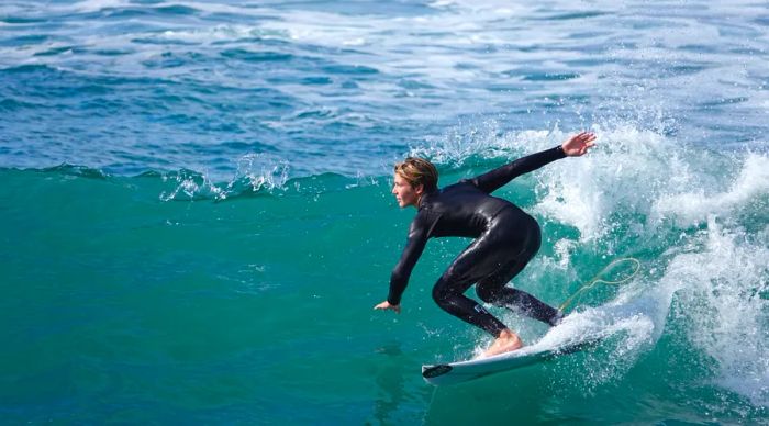 A surfer enjoying the waves in San Diego