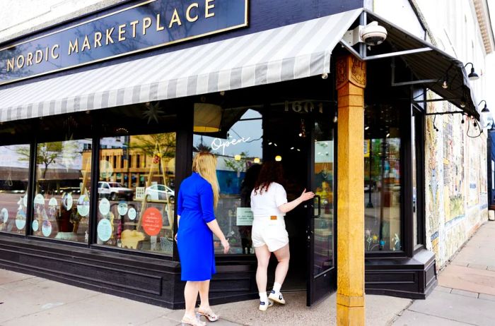 Two individuals entering Ingebretsen’s in Minneapolis