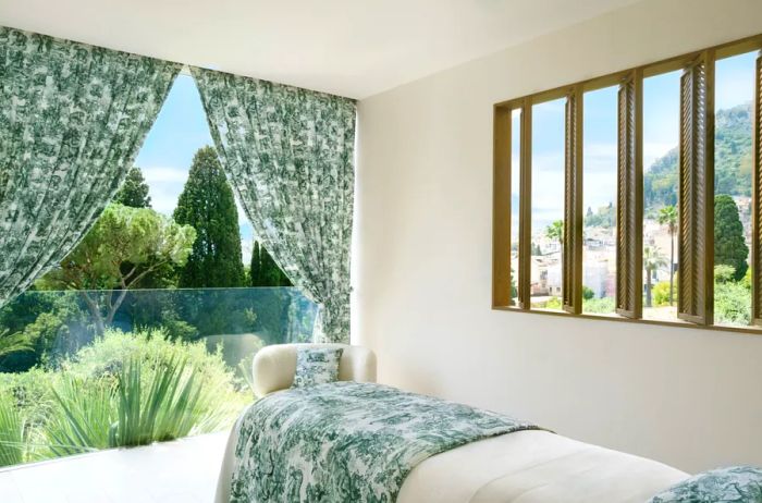 Interior view of a Dior spa suite at the Grand Hotel Timeo, featuring expansive windows