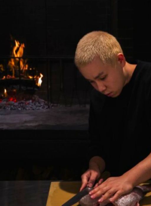 Chef Jonathan Yao skillfully filleting a fish