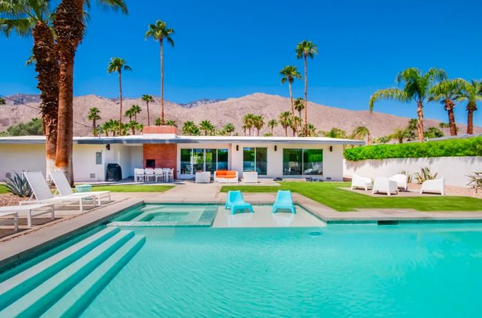 Midcentury Airbnb in Palm Springs featuring a spacious pool