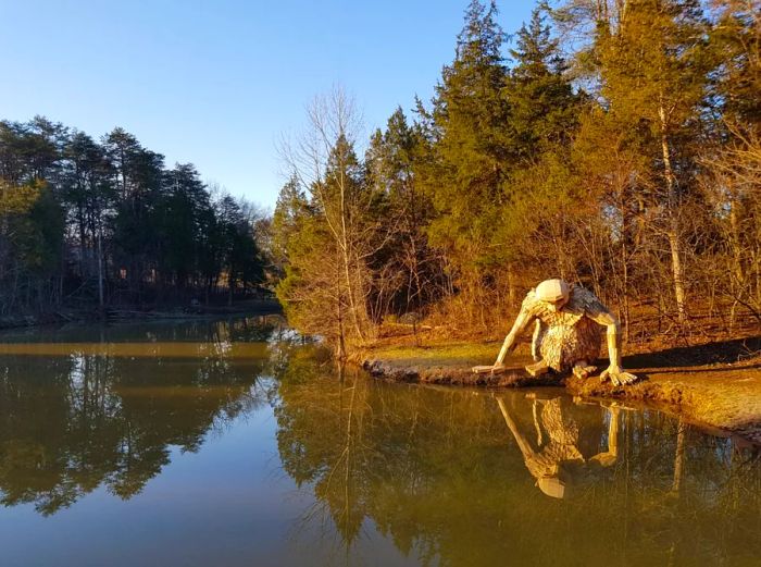 The Little Nis statue stands proudly by a lake in Louisville, Kentucky.