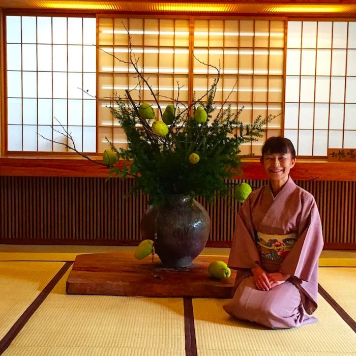 A hostess welcomes guests at Kayotei Ryokan.