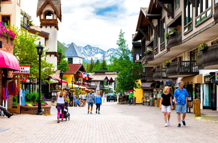 People strolling along a cobblestone street in Vail, Colorado