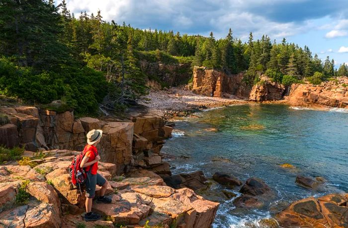 Hiker exploring Acadia National Park, Canada