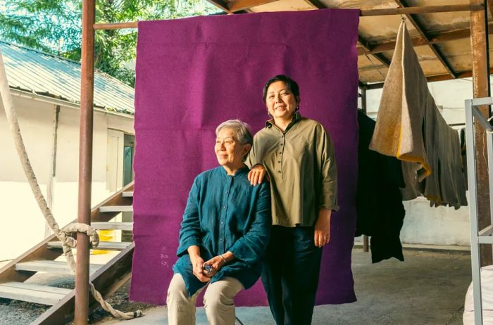 Felting artists Roza and Chinara Makashova pose for a photograph together.