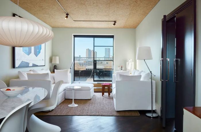 Guest room interior featuring sleek white furnishings