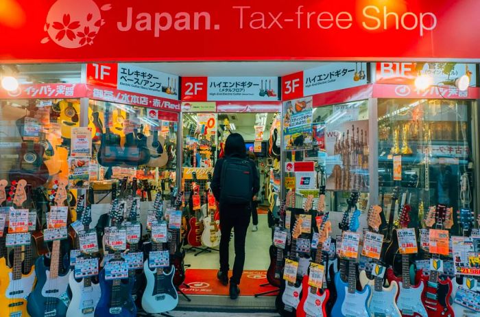 Japan tax-free shop sign above a guitar store