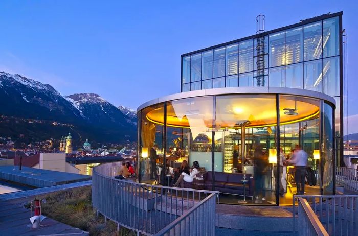 Take in the breathtaking views of Innsbruck’s majestic mountains from the 360-degree bar, Cafe Lichtblick.