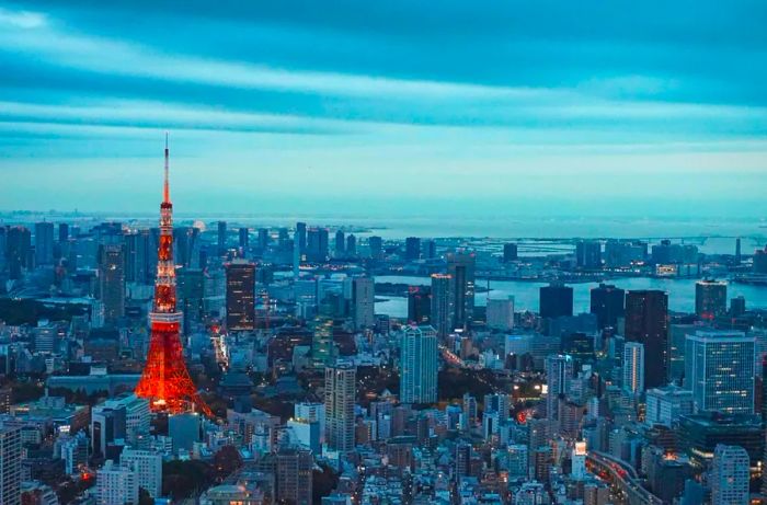 A stunning aerial view of Tokyo Tower illuminated at night in Ginza