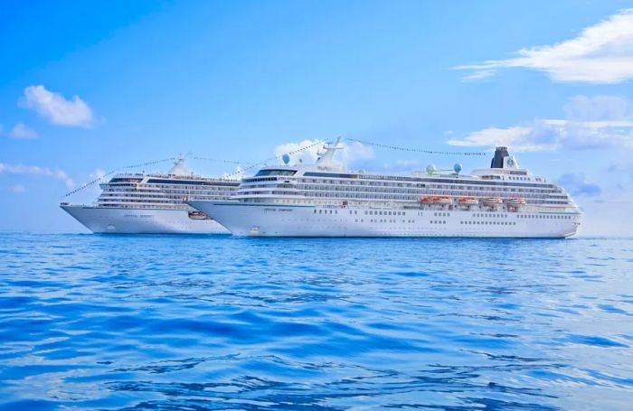 The two vessels, Crystal Symphony and Crystal Serenity, positioned side by side