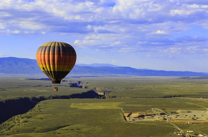 A hot air balloon soaring above Taos