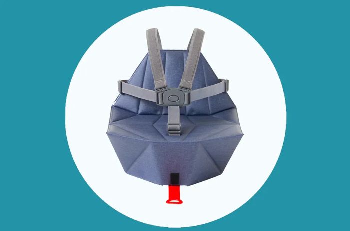 The Bombol Pop-Up Booster seat with seat belts in gray.