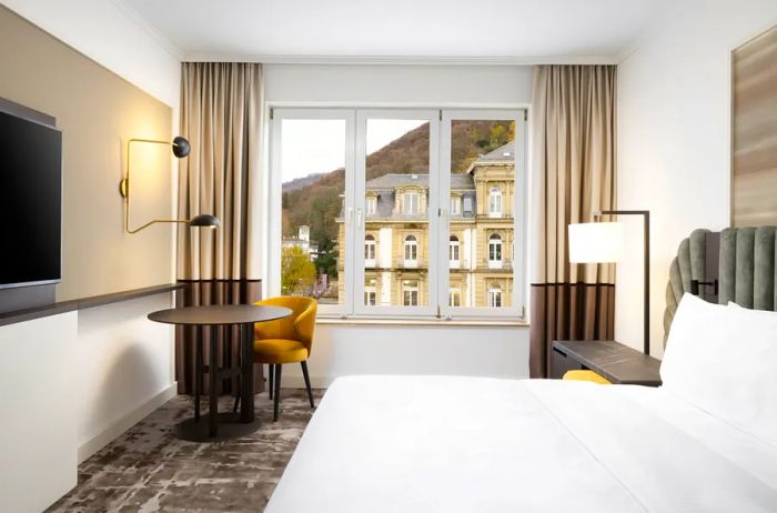 A room at the Hilton Heidelberg in Germany, showcasing a view of the historic Heidelberg Old Town