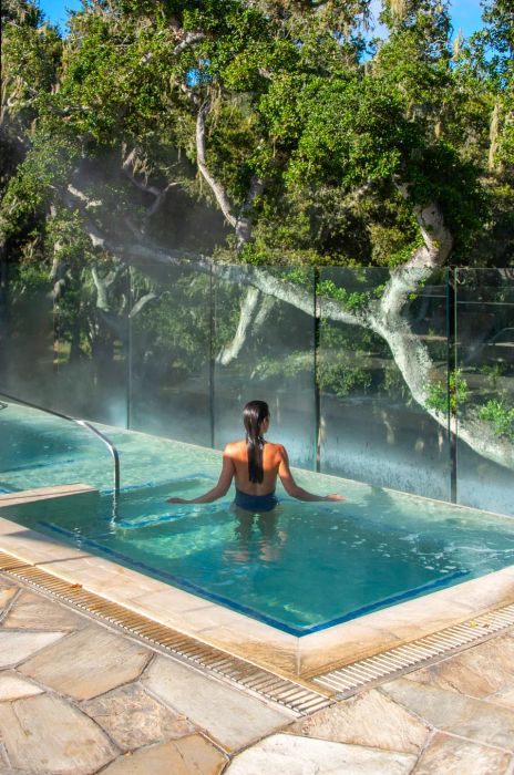 A woman enjoying relaxation in an outdoor spa at Carmel Valley Ranch