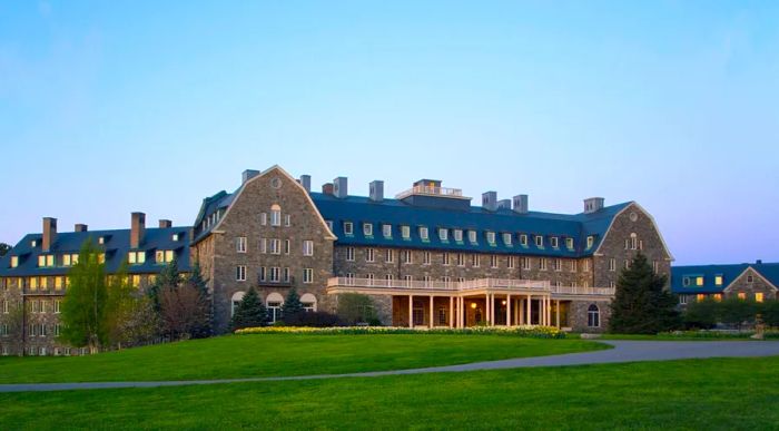 The impressive exterior of Skytop Lodge, surrounded by lush green lawns.