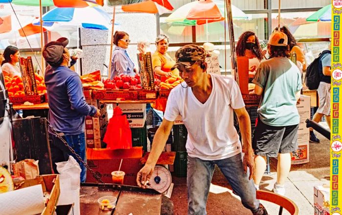 Street vendors offer fresh fruits and vegetables in New York City’s Chinatown.