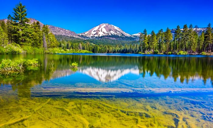 Lassen Peak beautifully reflected in the waters of Manzanita Lake.