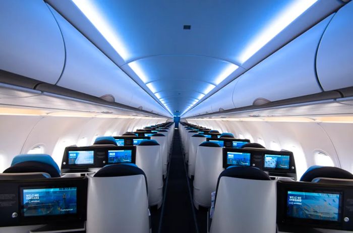 Interior view of La Compagnie’s all-business aircraft, showcasing business-class seats arranged in pairs of two by two