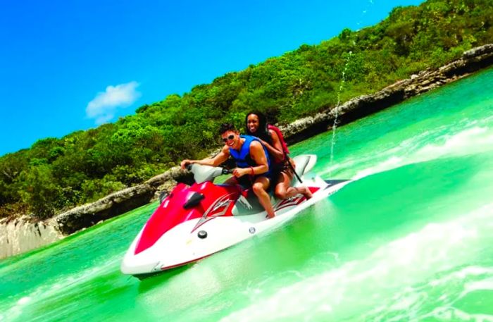 Experience the thrill of riding a Wave Runner on Great Stirrup Cay, Dinogo's exclusive paradise.