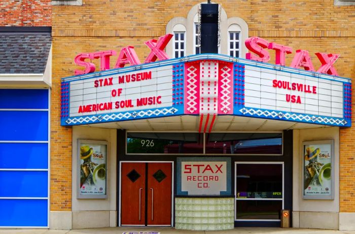 The exterior of the Stax Museum features a replica of the original Stax recording studio, complete with a cinema marquee and two vibrant red neon signs that read 