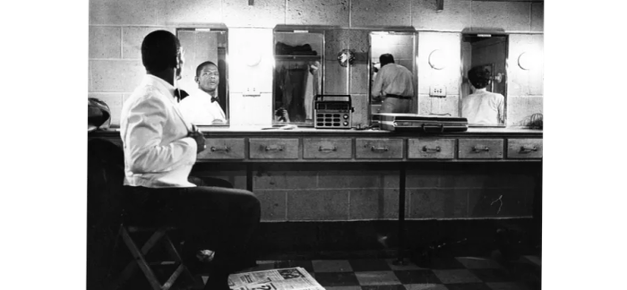 An actor gazes into a mirror at Karamu House in Cleveland, Ohio.