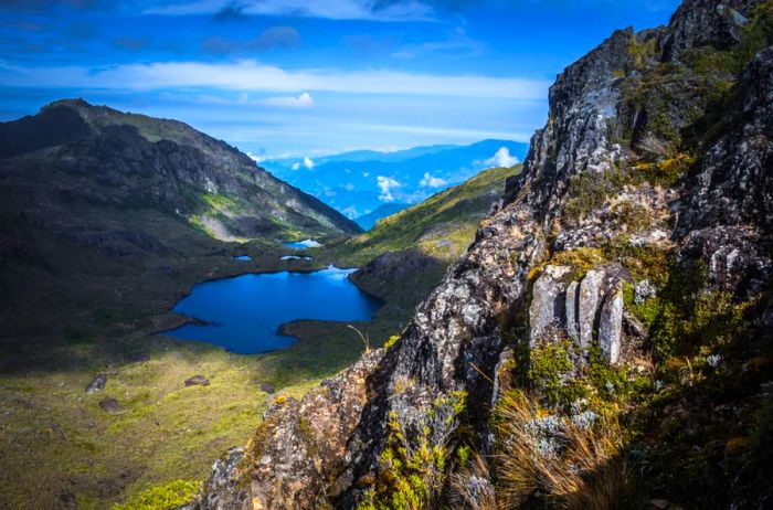 A serene lake nestled in a mountainous region during the day